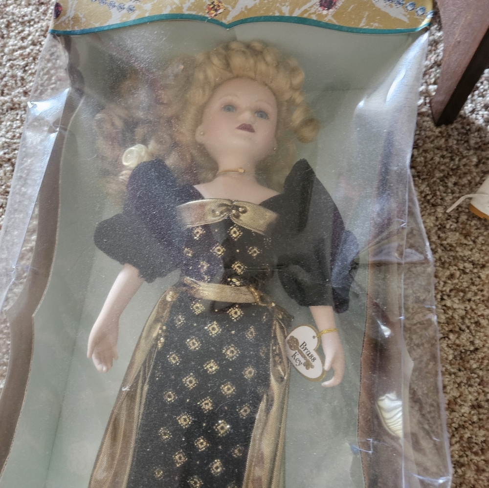 Victorian season's collectible brass key, genuine porcelain doll
